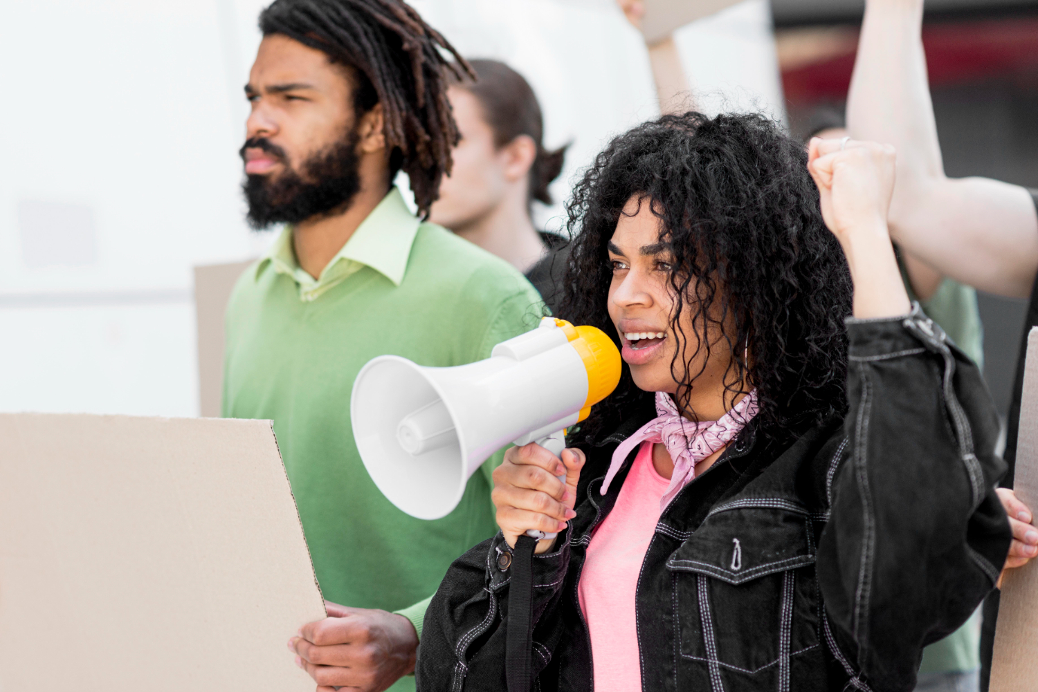 Young people campaigning with a megaphone (illustrative photo)
